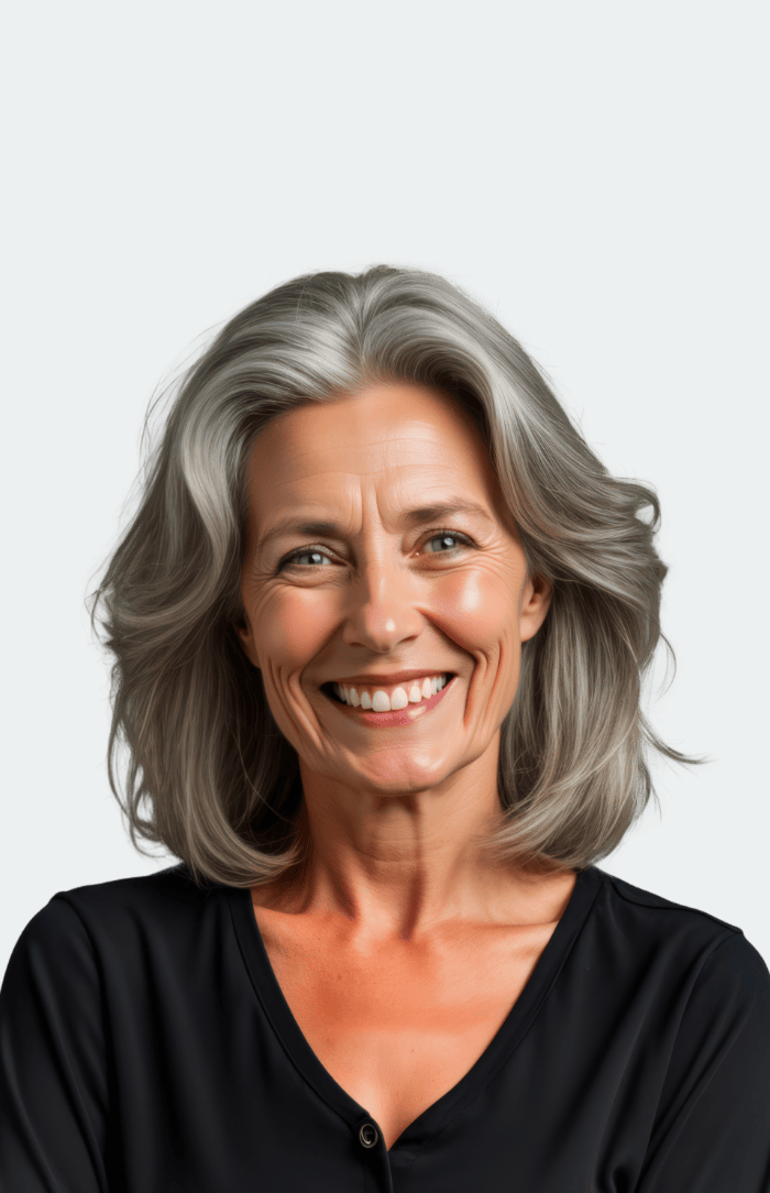 Eine lachende Frau mittleren Alters.